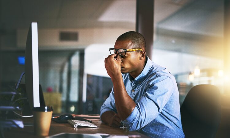 A leader under pressure at his desk